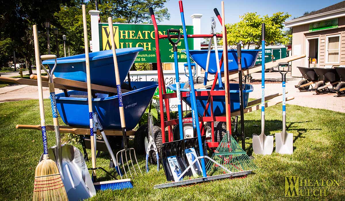 Wolverine wheelbarrows, shovels and rakes for sale outside the office
