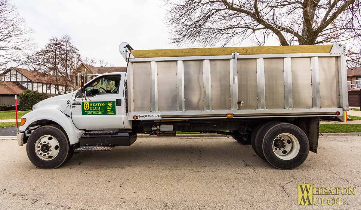 A Wheaton Mulch dump truck ready for a delivery run