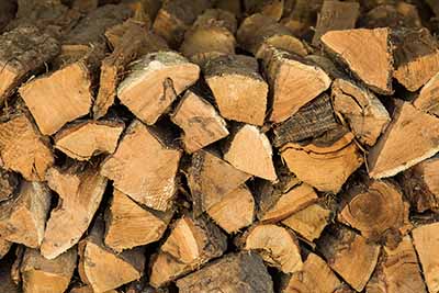 Kiln dried firewood stacked and covered