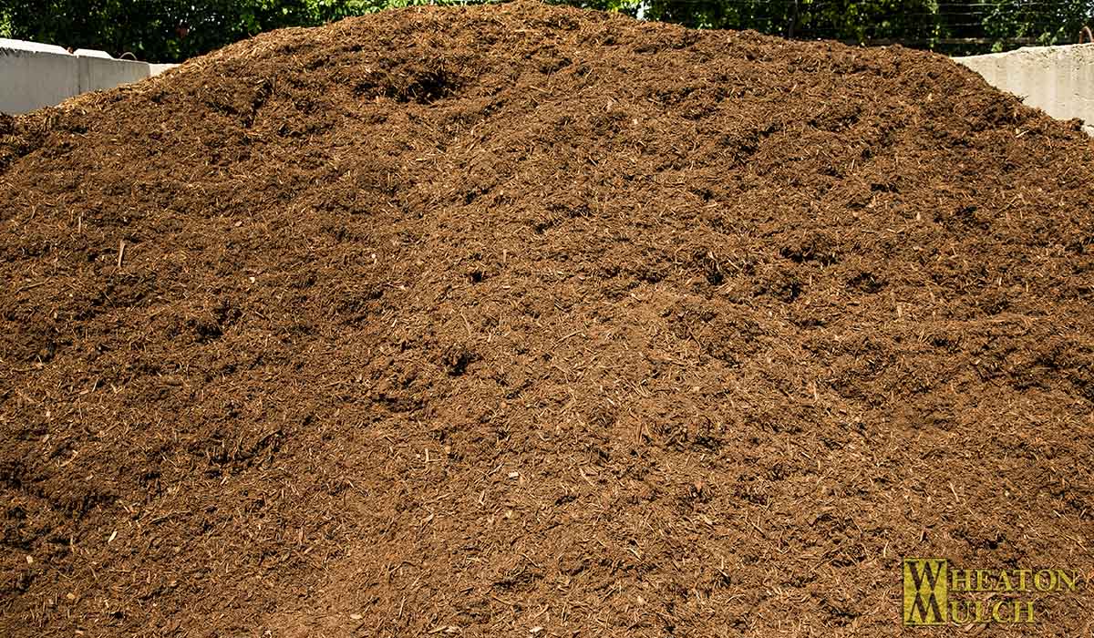 Premium shredded hardwood bark mulch, dark brown and finely shredded