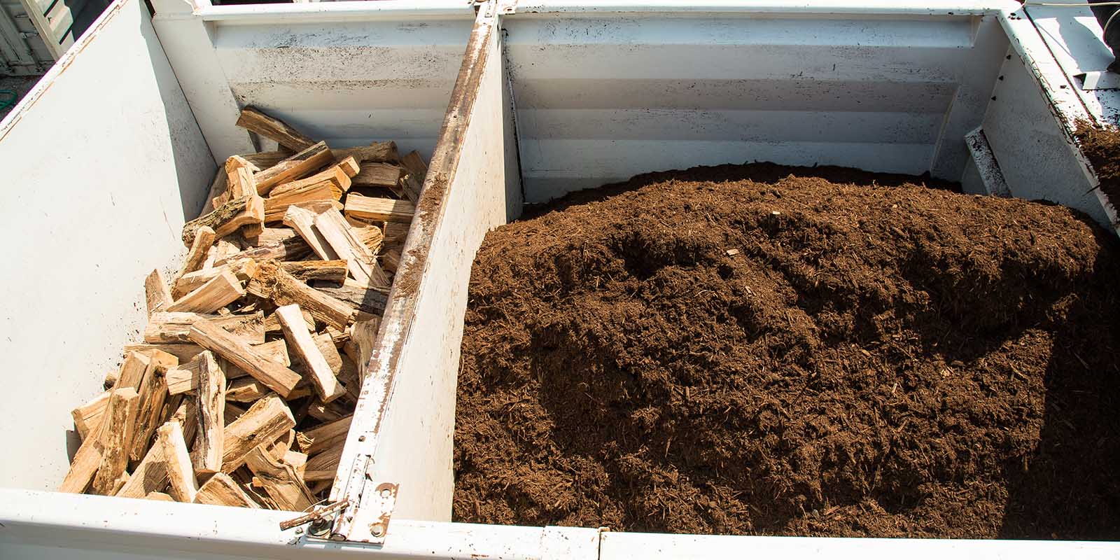 A Wheaton Mulch split load delivery truck with a divider separating two products